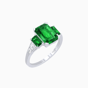 Art Deco Inspired Emerald Cut Three-Stone Ring with Tapered Baguettes - Shahin Jewelry
